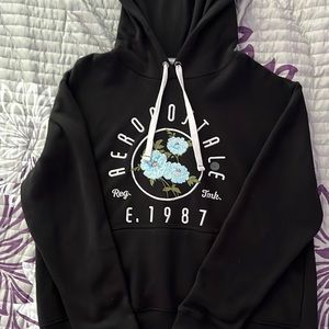 Womens Aeropostale hoodie black with light blue flower detail and logo.